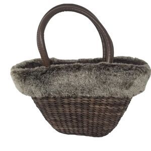 Cute Bath and Body Works hand bag. Brown wicker with faux fur accent.